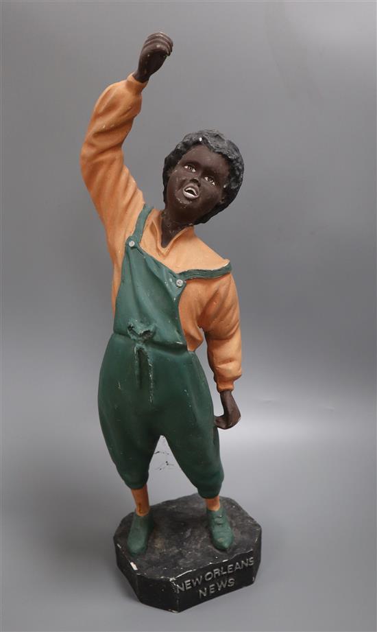 After Steinberg. A painted plaster advertising figure, New Orleans newspaper vendor, height 55cm